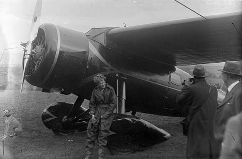 Amelia Earhart sits on the wheel of her Vega 5B in Derry, Ireland after crossing the Atlantic Ocean alone. (Author unknown)
