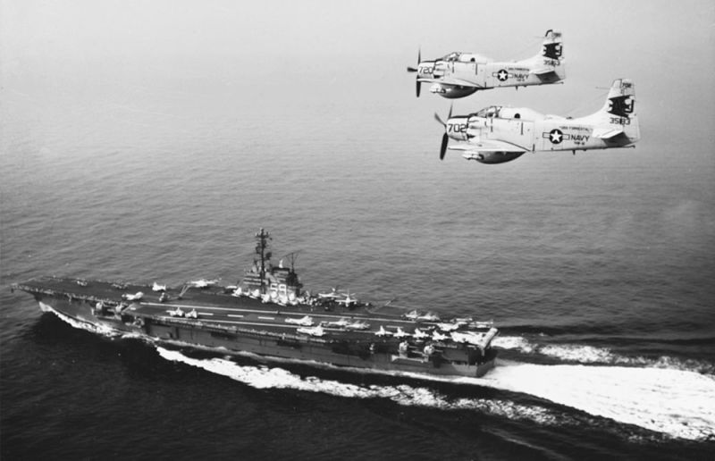 Two Douglas AD-5W Skyraiders fly over USS Forrestal during operations with the Sixth Fleet in the Mediterranean Sea in 1960. (US Navy)