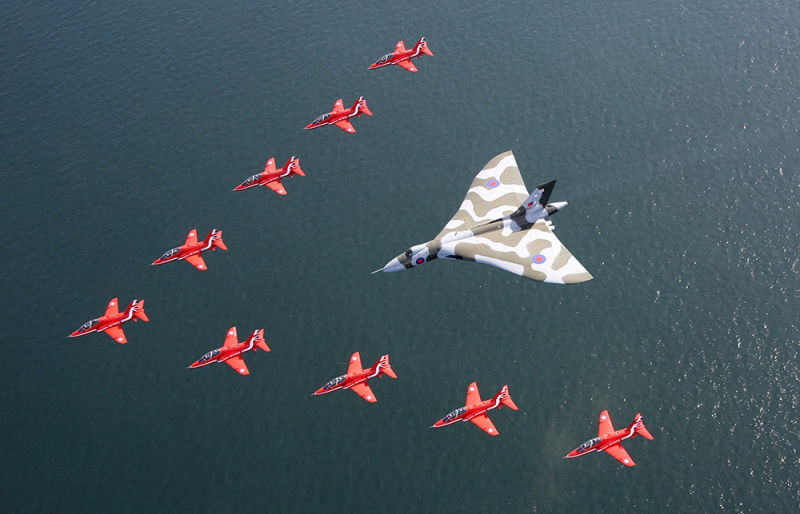 The final Vulcan flies in formation with the RAF Red Arrows demonstration squadron in a ceremony marking the Vulcan’s retirement in 2005 (UK Ministry of Defence)