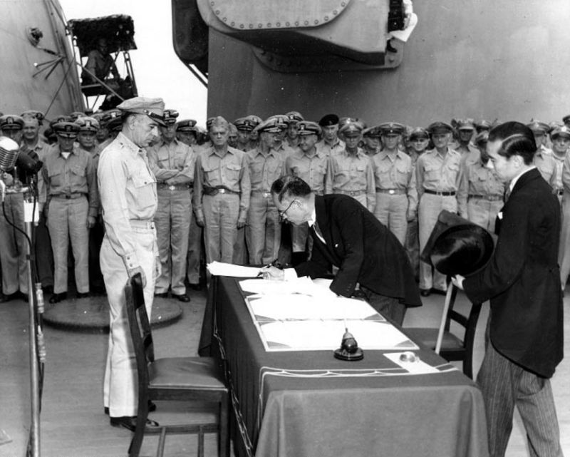 Japanese Foreign Minister Mamoru Shigemitsu signs the Instrument of Surrender on behalf of the Japanese Government, formally ending World War II 