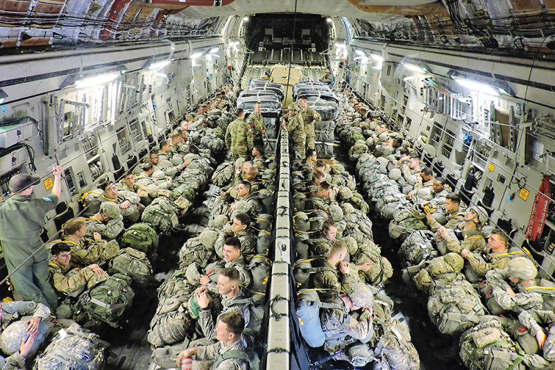 Paratroopers with the 82nd Airborne Division from Fort Bragg, North Carolina sit aboard a C-17 Globemaster III from the 249th Airlift Squadron, Alaska Air National Guard during a joint airborne air transportability training mission in 2016. (US Air Force)