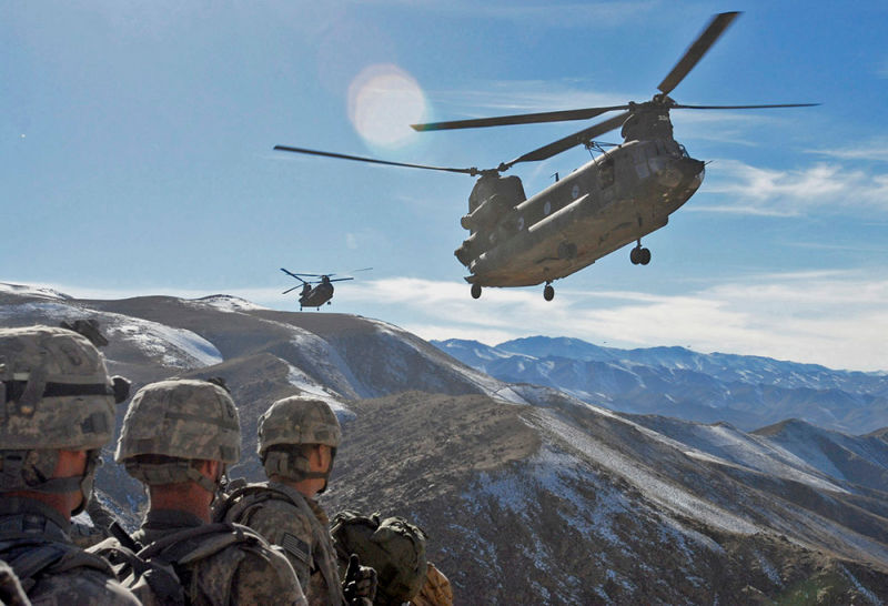 The Chinook has proven particularly useful in Afghanistan, where its powerful engines allow it to operate at higher altitudes and in hotter temperatures than other Army helicopters. Here, Chinooks arrive to pick up US Army soldiers following a mission. (US Army)