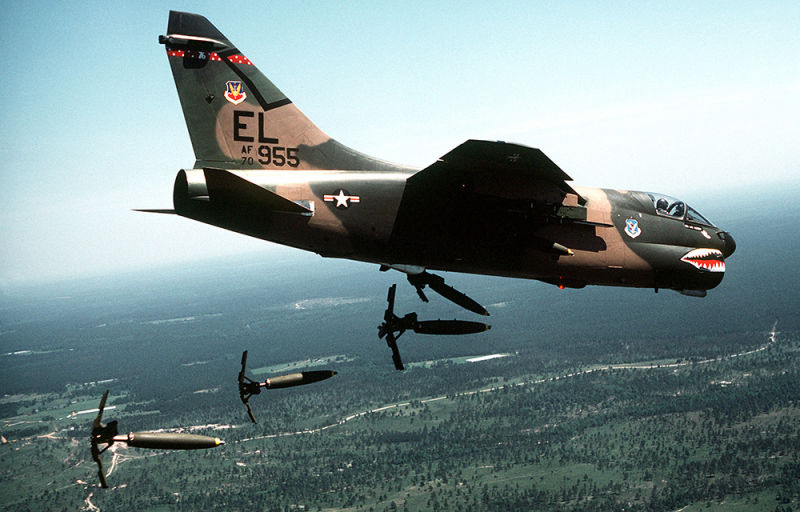 A US Air Force A-7D Corsair II from the 76th Tactical Fighter Squadron drops Mark 82 hi-drag bombs over a bombing range in Florida. (US Air Force)