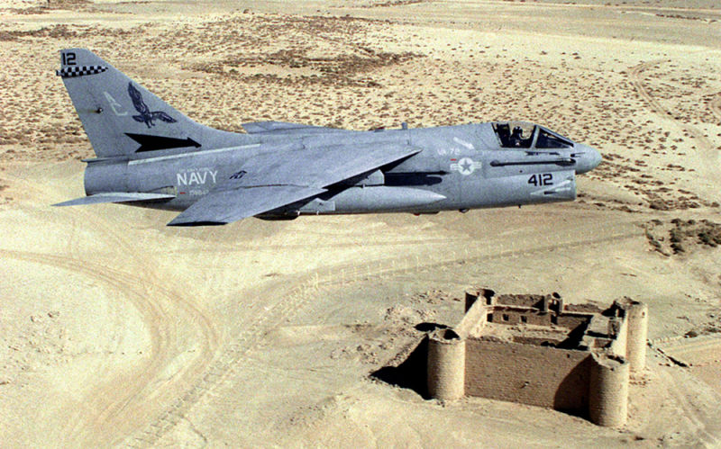 A US Navy A-7E Corsair II from attack squadron VA-72 Blue Hawks passes over a ruined fort in the Saudi desert during Operation Desert Shield in 1990. (US Navy)