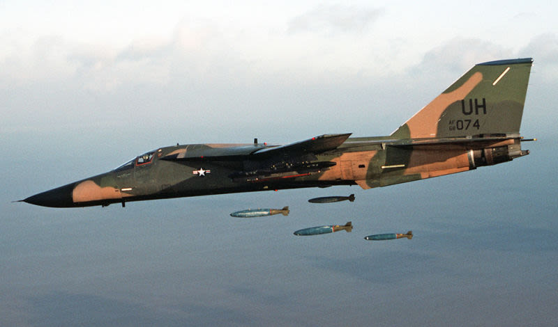 An F-11E of the 20th Tactical Fighter Wing drops bombs over a bombing range (US Department of Defense)