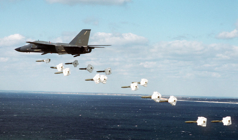 An FB-111A of the 509th Bombardment Wing drops Mark 82 high drag practice bombs during a training exercise (US Air Force)