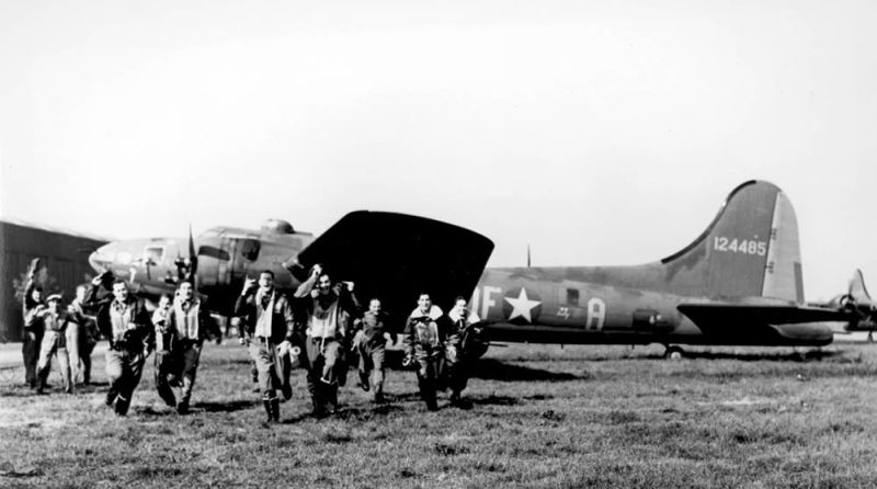 The jubilant crew of Memphis Belle leaves the bomber after their final mission (US Air Force)