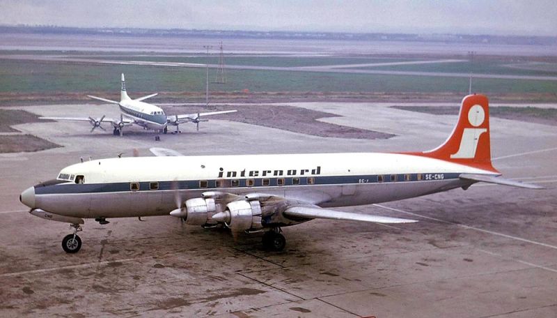A DC-7 of Internord Airlines passes a Vickers Viscount parked at Liverpool Airport (Ken Fielding)