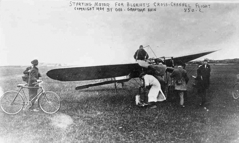 Blériot, standing in the cockpit of his Type XI monoplane, prepares for his cross-channel flight on July 25, 1909