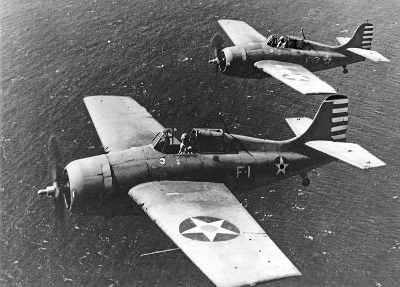 A pair of US Navy Grumman F4F-3 Wildcats from Fighting Squadron 3 (VF-3) in flight over Oahu, Hawaii, in April 1942. The planes are flown by VF-3 Commanding Officer LTC John S. Thach (front) and LT Edward “Butch” O’Hare, the Navy’s first ace of WWII. O’Hare was killed in action in 1943 near the Gilbert Islands. 