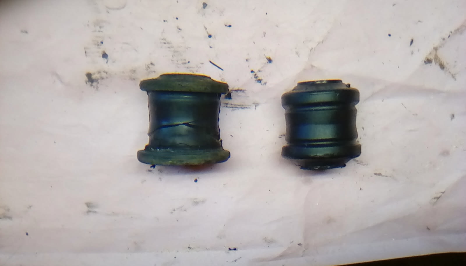 LEFT: old control arm bushing RIGHT: new control arm bushing