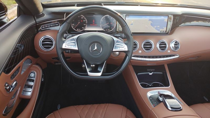 Virtual gauges on the dashboard with heated steering wheel, door and center armrests. 